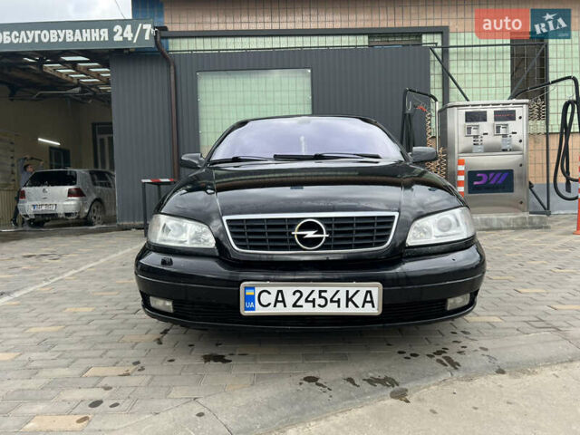 Черный Опель Омега, объемом двигателя 2.5 л и пробегом 280 тыс. км за 4300 $, фото 1 на Automoto.ua