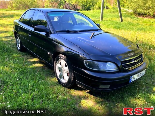 Черный Опель Омега, объемом двигателя 2.2 л и пробегом 350 тыс. км за 3000 $, фото 1 на Automoto.ua