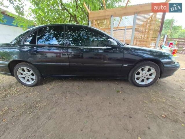 Черный Опель Омега, объемом двигателя 2.5 л и пробегом 300 тыс. км за 4000 $, фото 5 на Automoto.ua