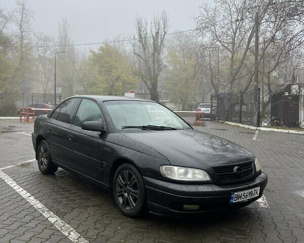 Черный Опель Омега, объемом двигателя 2.2 л и пробегом 320 тыс. км за 2999 $, фото 2 на Automoto.ua