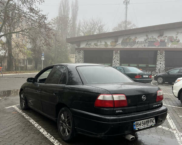 Черный Опель Омега, объемом двигателя 2.2 л и пробегом 320 тыс. км за 2999 $, фото 6 на Automoto.ua