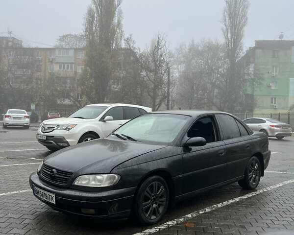 Черный Опель Омега, объемом двигателя 2.2 л и пробегом 320 тыс. км за 2999 $, фото 5 на Automoto.ua