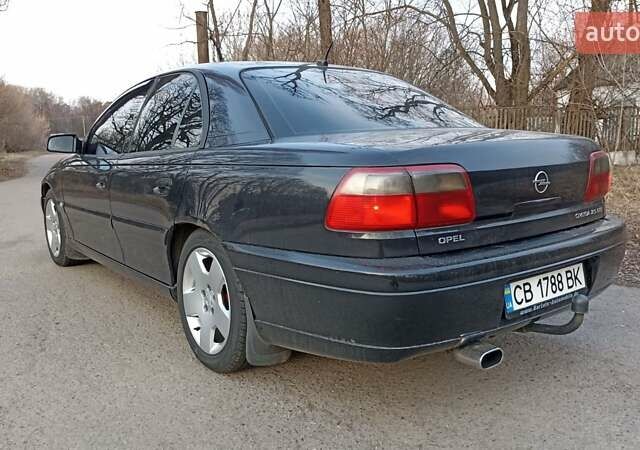 Черный Опель Омега, объемом двигателя 2.5 л и пробегом 295 тыс. км за 4400 $, фото 4 на Automoto.ua