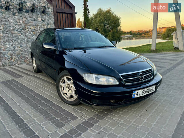 Чорний Опель Омега, об'ємом двигуна 2.2 л та пробігом 312 тис. км за 2999 $, фото 44 на Automoto.ua