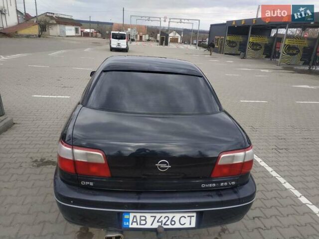Черный Опель Омега, объемом двигателя 2.6 л и пробегом 300 тыс. км за 3100 $, фото 5 на Automoto.ua