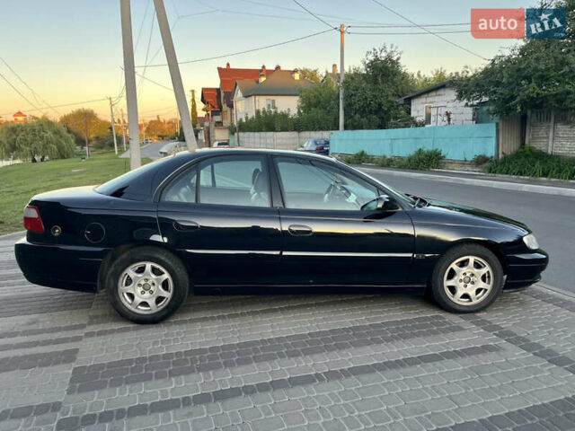 Чорний Опель Омега, об'ємом двигуна 2.2 л та пробігом 312 тис. км за 2999 $, фото 37 на Automoto.ua