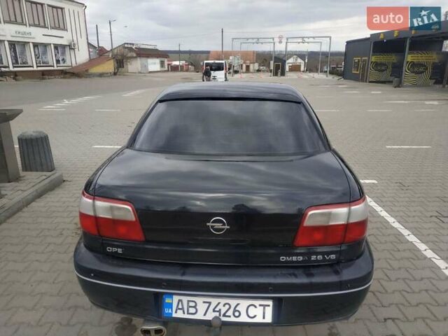 Черный Опель Омега, объемом двигателя 2.6 л и пробегом 300 тыс. км за 3100 $, фото 11 на Automoto.ua