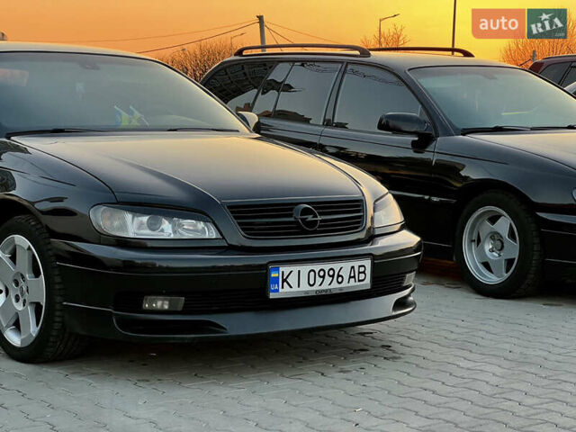Чорний Опель Омега, об'ємом двигуна 2.2 л та пробігом 335 тис. км за 4000 $, фото 5 на Automoto.ua