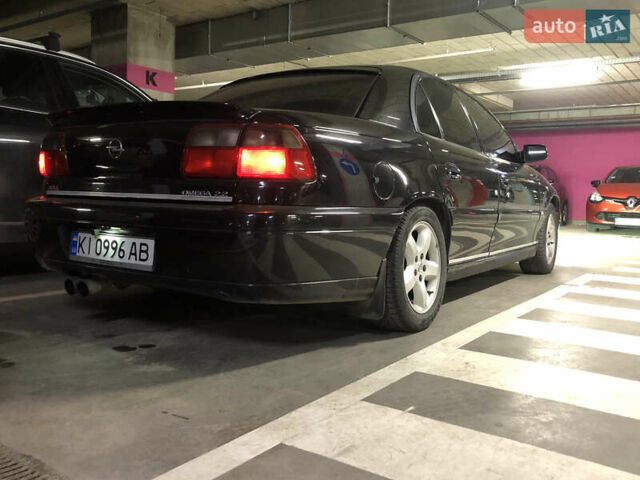 Чорний Опель Омега, об'ємом двигуна 2.2 л та пробігом 335 тис. км за 4000 $, фото 16 на Automoto.ua