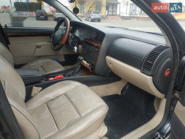 Черный Опель Омега, объемом двигателя 2.6 л и пробегом 300 тыс. км за 3100 $, фото 9 на Automoto.ua