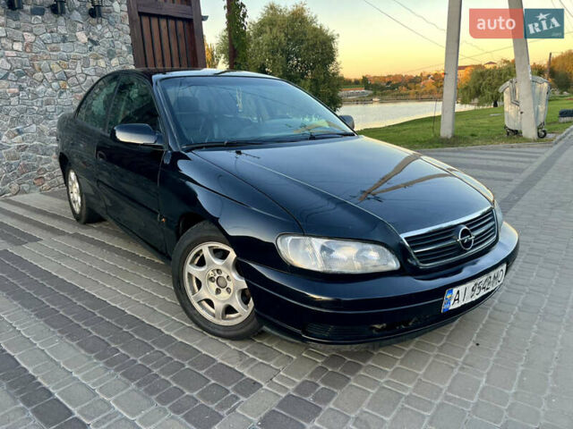 Чорний Опель Омега, об'ємом двигуна 2.2 л та пробігом 312 тис. км за 2999 $, фото 42 на Automoto.ua