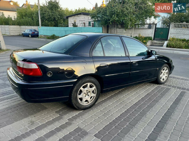 Чорний Опель Омега, об'ємом двигуна 2.2 л та пробігом 312 тис. км за 2999 $, фото 34 на Automoto.ua