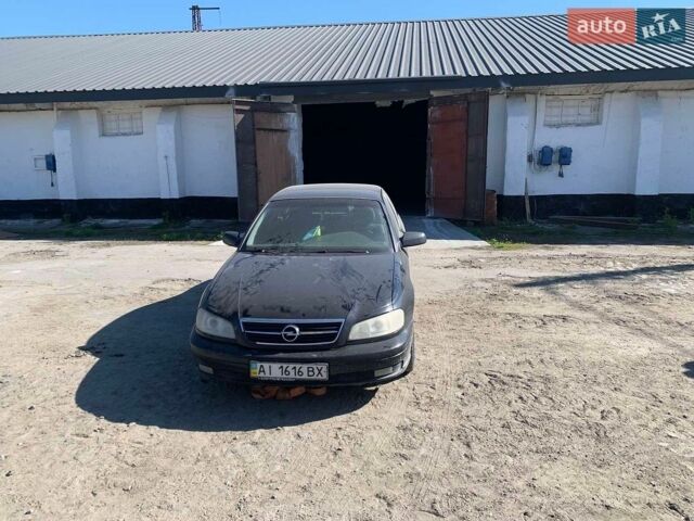 Черный Опель Омега, объемом двигателя 2.2 л и пробегом 434 тыс. км за 1600 $, фото 10 на Automoto.ua