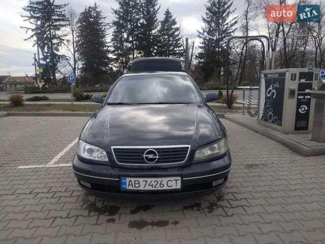 Черный Опель Омега, объемом двигателя 2.6 л и пробегом 300 тыс. км за 3100 $, фото 1 на Automoto.ua