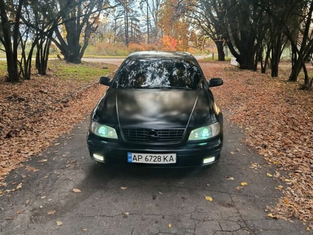 Черный Опель Омега, объемом двигателя 2.6 л и пробегом 350 тыс. км за 3700 $, фото 4 на Automoto.ua