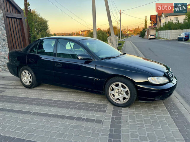 Чорний Опель Омега, об'ємом двигуна 2.2 л та пробігом 312 тис. км за 2999 $, фото 38 на Automoto.ua