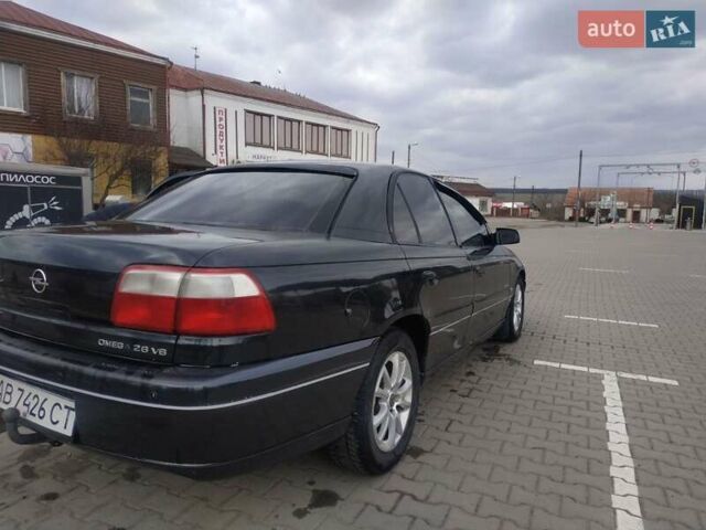 Черный Опель Омега, объемом двигателя 2.6 л и пробегом 300 тыс. км за 3100 $, фото 18 на Automoto.ua