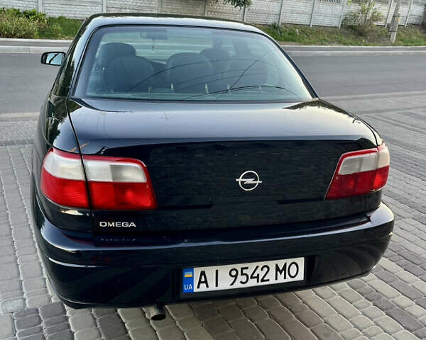 Чорний Опель Омега, об'ємом двигуна 2.2 л та пробігом 312 тис. км за 2999 $, фото 24 на Automoto.ua