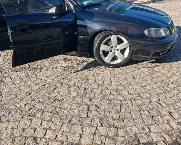 Черный Опель Омега, объемом двигателя 2.5 л и пробегом 215 тыс. км за 3000 $, фото 6 на Automoto.ua