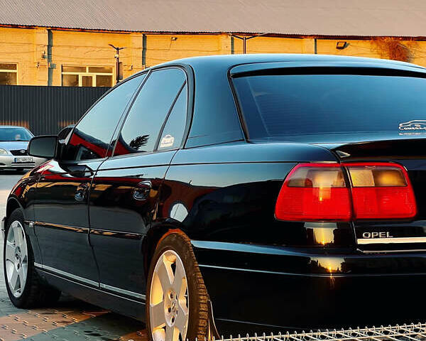 Черный Опель Омега, объемом двигателя 2.2 л и пробегом 335 тыс. км за 4100 $, фото 2 на Automoto.ua