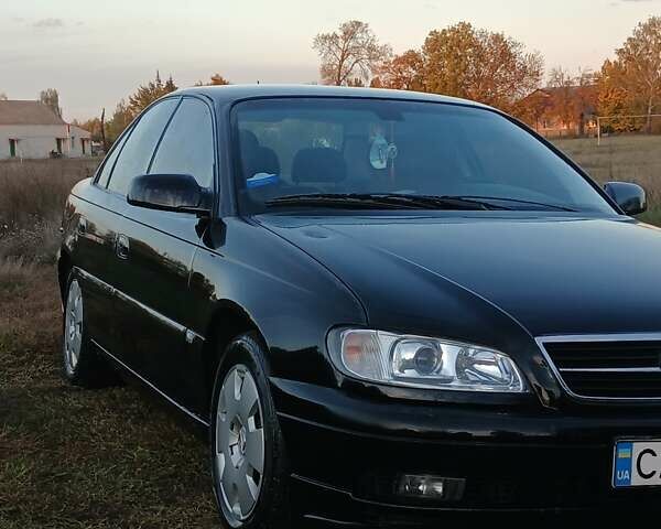 Опель Омега 2003 в Черкассах на Automoto.ua Черный Опель Омега, объемом двигателя 2.17 л и пробегом 273 тыс. км за 4200 $, фото 4 на Automoto.ua