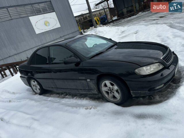 Черный Опель Омега, объемом двигателя 2.6 л и пробегом 245 тыс. км за 2600 $, фото 11 на Automoto.ua