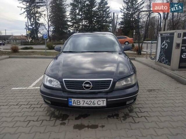 Черный Опель Омега, объемом двигателя 2.6 л и пробегом 300 тыс. км за 3100 $, фото 10 на Automoto.ua