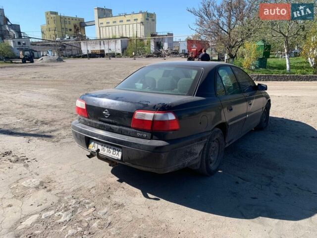 Черный Опель Омега, объемом двигателя 2.2 л и пробегом 434 тыс. км за 1600 $, фото 11 на Automoto.ua