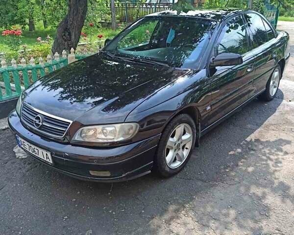 Черный Опель Омега, объемом двигателя 2.2 л и пробегом 304 тыс. км за 4000 $, фото 2 на Automoto.ua