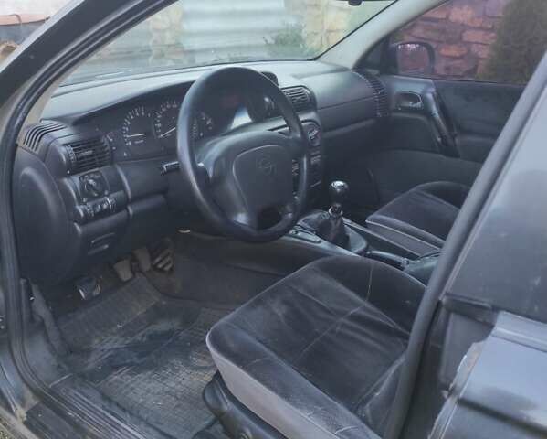 Черный Опель Омега, объемом двигателя 2 л и пробегом 195 тыс. км за 2700 $, фото 5 на Automoto.ua