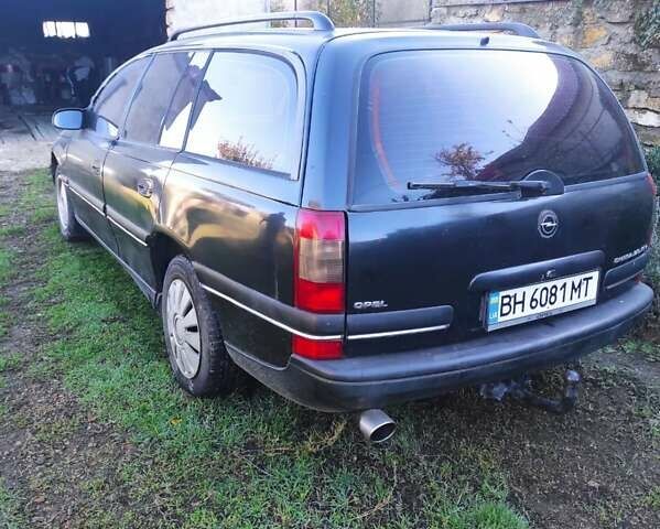 Черный Опель Омега, объемом двигателя 2 л и пробегом 195 тыс. км за 2700 $, фото 11 на Automoto.ua