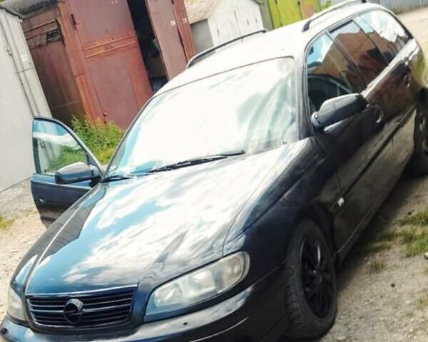 Черный Опель Омега, объемом двигателя 2.2 л и пробегом 220 тыс. км за 3000 $, фото 3 на Automoto.ua