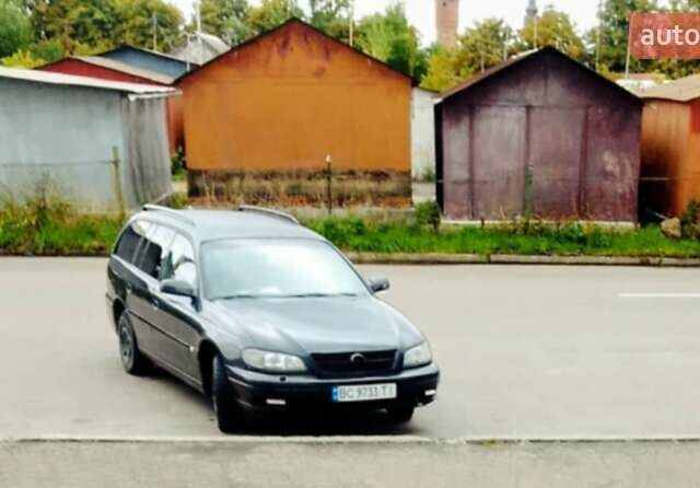 Черный Опель Омега, объемом двигателя 2.2 л и пробегом 220 тыс. км за 3000 $, фото 2 на Automoto.ua
