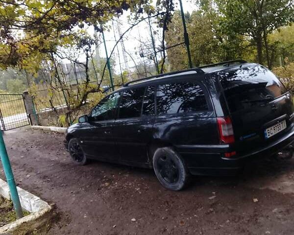 Черный Опель Омега, объемом двигателя 2.2 л и пробегом 220 тыс. км за 3000 $, фото 9 на Automoto.ua