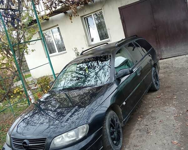 Черный Опель Омега, объемом двигателя 2.2 л и пробегом 220 тыс. км за 3000 $, фото 6 на Automoto.ua