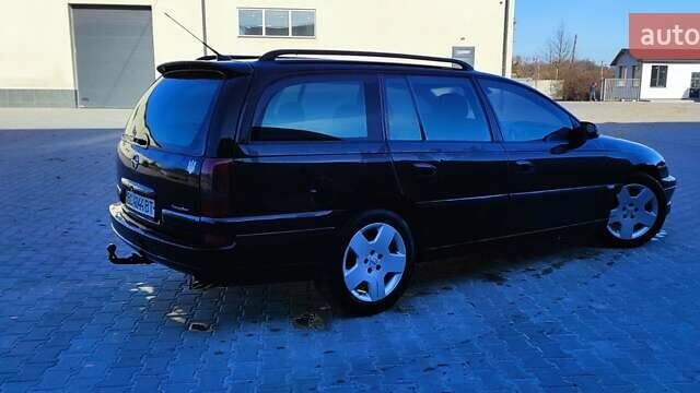 Черный Опель Омега, объемом двигателя 2.5 л и пробегом 288 тыс. км за 4800 $, фото 3 на Automoto.ua