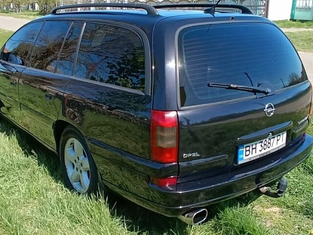 Черный Опель Омега, объемом двигателя 2.2 л и пробегом 330 тыс. км за 4000 $, фото 6 на Automoto.ua