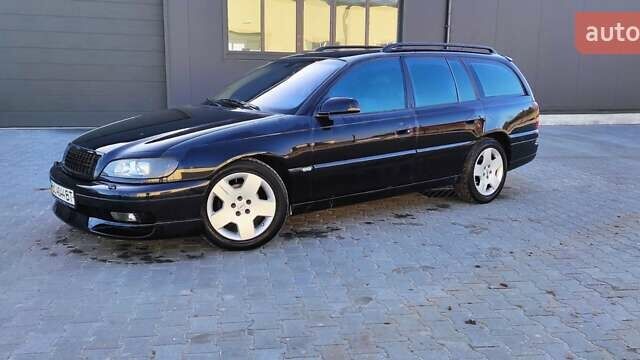 Черный Опель Омега, объемом двигателя 2.5 л и пробегом 288 тыс. км за 4800 $, фото 2 на Automoto.ua