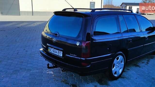 Черный Опель Омега, объемом двигателя 2.5 л и пробегом 288 тыс. км за 4800 $, фото 5 на Automoto.ua