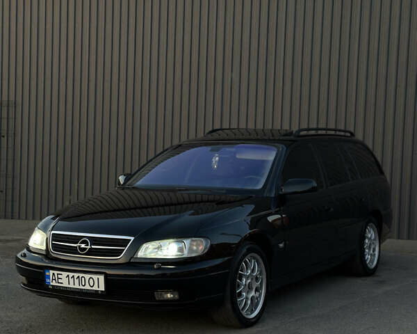 Черный Опель Омега, объемом двигателя 2.5 л и пробегом 330 тыс. км за 6000 $, фото 2 на Automoto.ua