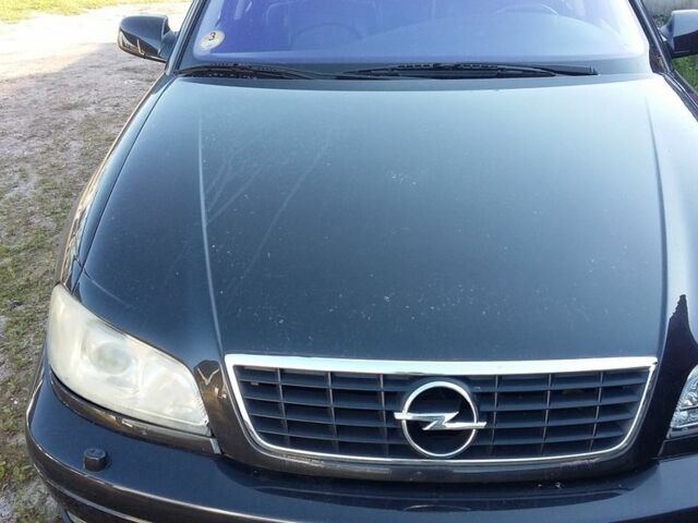 Черный Опель Омега, объемом двигателя 2.2 л и пробегом 30 тыс. км за 1600 $, фото 2 на Automoto.ua