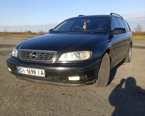 Черный Опель Омега, объемом двигателя 2.5 л и пробегом 334 тыс. км за 3800 $, фото 12 на Automoto.ua