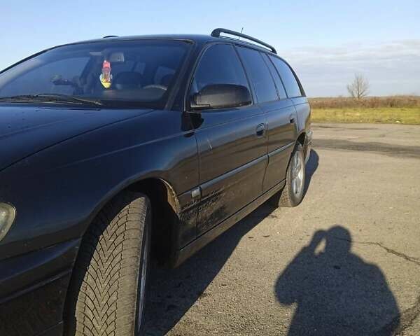 Черный Опель Омега, объемом двигателя 2.5 л и пробегом 334 тыс. км за 4200 $, фото 13 на Automoto.ua