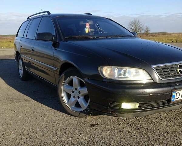 Черный Опель Омега, объемом двигателя 2.5 л и пробегом 334 тыс. км за 4200 $, фото 9 на Automoto.ua