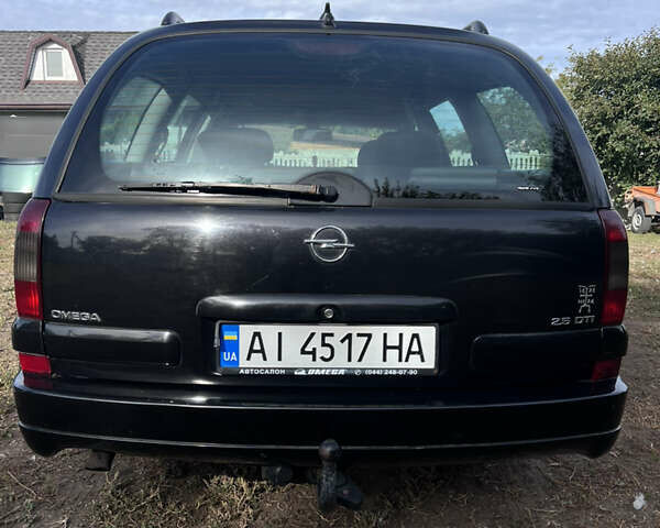 Черный Опель Омега, объемом двигателя 2.5 л и пробегом 300 тыс. км за 4000 $, фото 2 на Automoto.ua