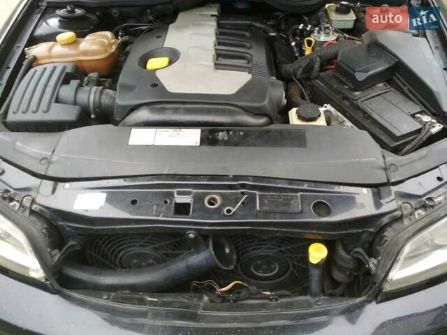 Черный Опель Омега, объемом двигателя 2.5 л и пробегом 243 тыс. км за 5900 $, фото 11 на Automoto.ua