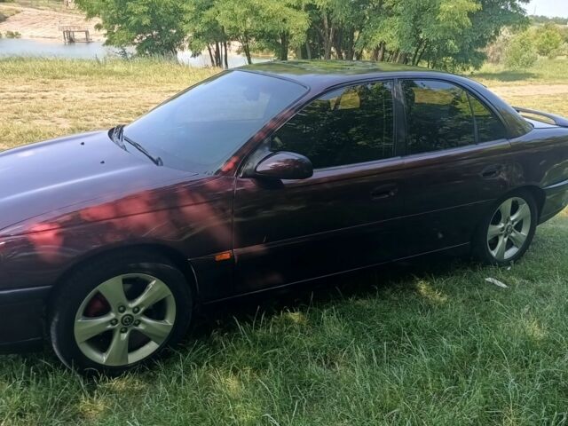 Фиолетовый Опель Омега, объемом двигателя 2.5 л и пробегом 250 тыс. км за 4200 $, фото 3 на Automoto.ua