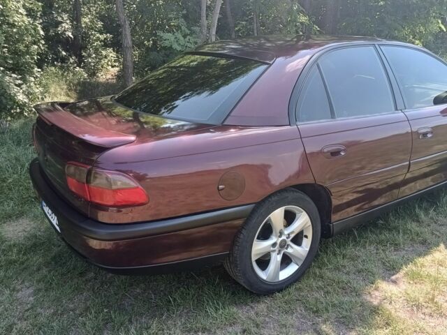 Фиолетовый Опель Омега, объемом двигателя 2.5 л и пробегом 250 тыс. км за 4200 $, фото 6 на Automoto.ua