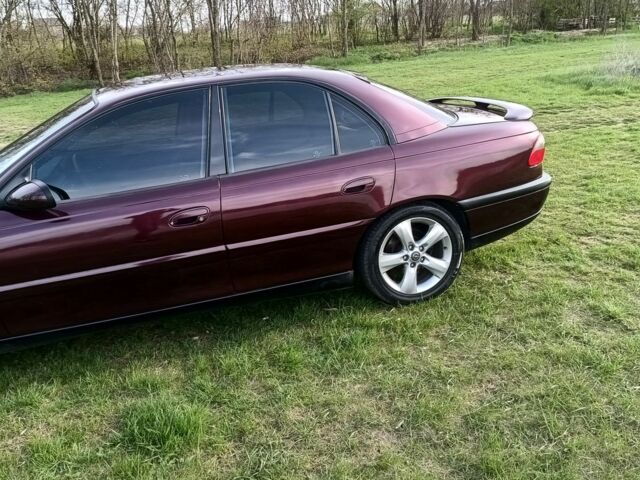 Фиолетовый Опель Омега, объемом двигателя 2.5 л и пробегом 250 тыс. км за 4200 $, фото 13 на Automoto.ua