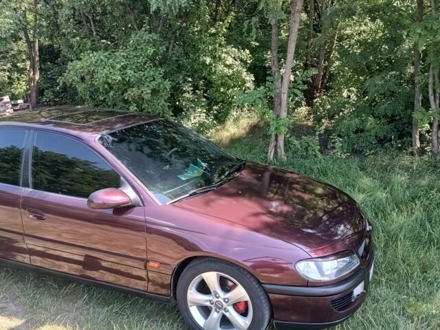 Фиолетовый Опель Омега, объемом двигателя 2.5 л и пробегом 250 тыс. км за 4200 $, фото 12 на Automoto.ua